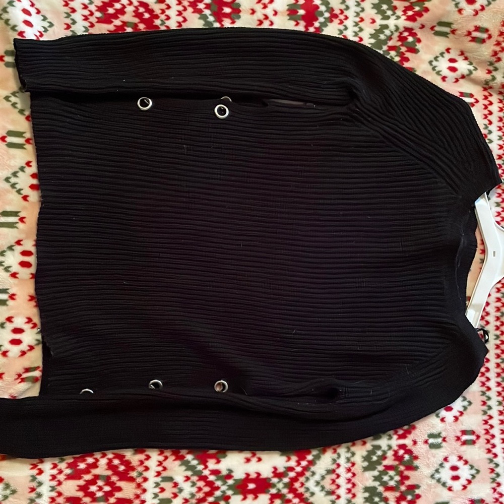 Simple long sleeve black sweater with open sides.